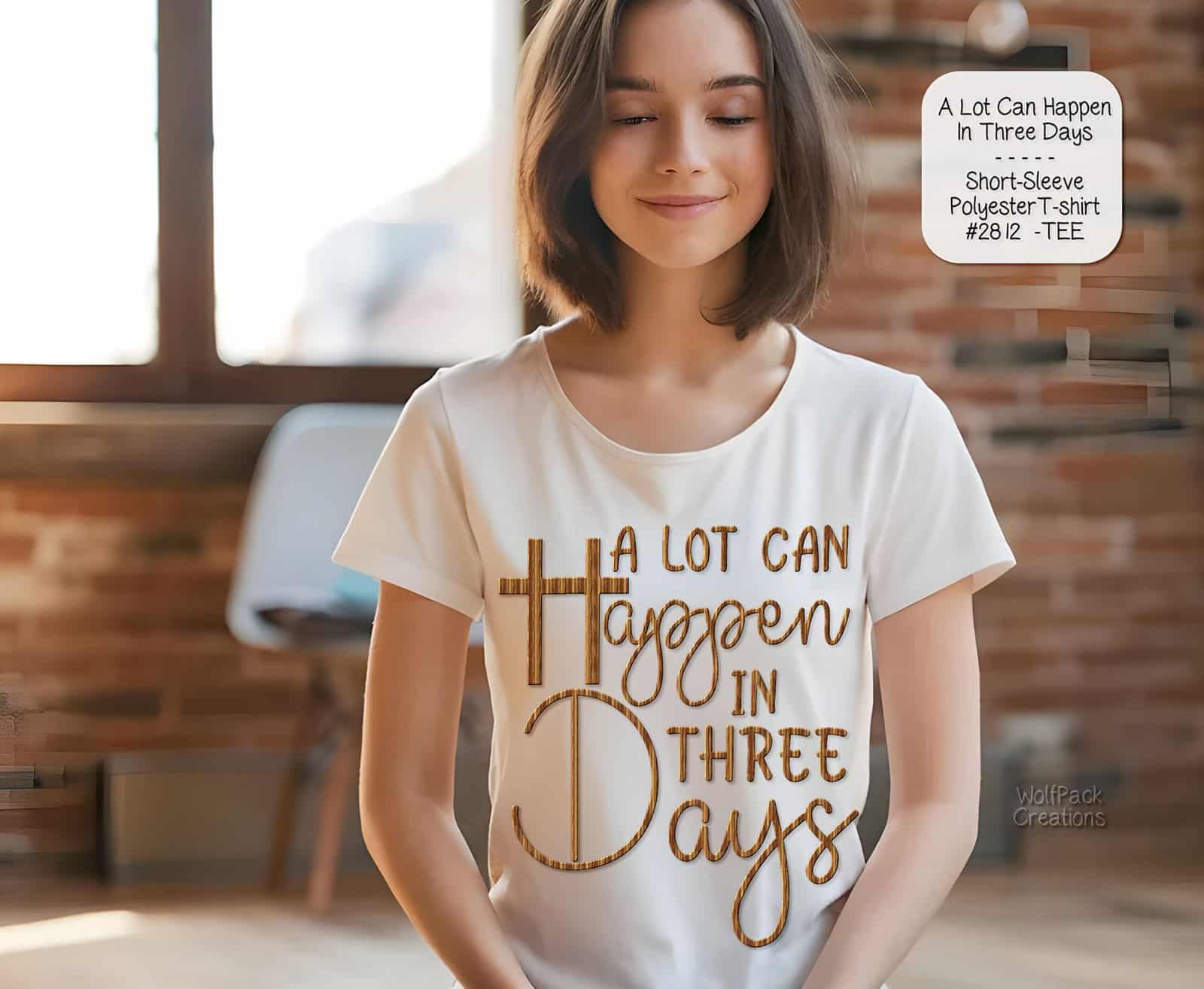 A mockup of a woman wearing a white t-shirt with the text "A lot can happen in three days" integrated with a cross design.
